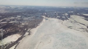 Flyover of Arviat, Nunavut, Canada as seen from an airplane at 10,000 feet