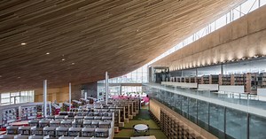 MIKAMI architects tops tonami public library with a giant wooden roof