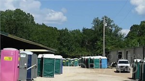 Katie cleans a porta-potty