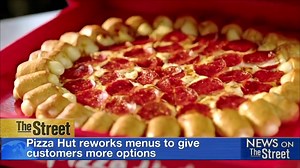 Pizza Hut is revamping its menu with some exotic additions! Customers will soon be able to spice up their #pizza orders with ingredients like honey #Sriracha sauce or curry flavors. A selection of low calorie 'skinny' pies will be added to the menu along with additional toppings and special crust flavors . The Texas-based chain has seen sales decline for eight straight quarters, even as rivals Domino's Pizza and Papa John's Pizza have reported gains. | TheStreet