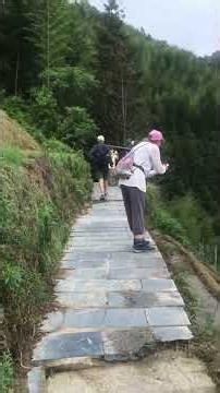 German Travelers Explore Longji Rice Terraces in Guilin
