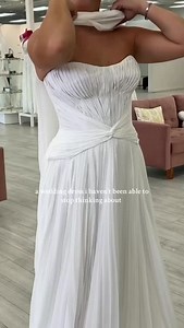 Obsessed is an under statement! 🤍⁠ ⁠ This pleated chiffon wedding dress, with its sculpted bodice and effortlessly draped silhouette, exudes goddess energy from every angle. A timeless, modern bridal look that will leave everyone breathless as you float down the aisle.⁠ ⁠ Exclusively available at Strut Bridal Salon in Chandler, AZ — come try it on and experience the magic for yourself.⁠ ⁠ ⁠ ⁠ ⁠ #weddingdressinspo #modernbride #chiffonweddingdress #pleateddress #bridetobe #minimalistbride #brida