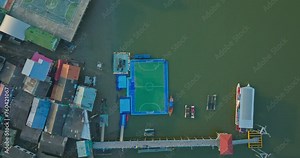 Aerial view Koh Panyee is A small island full of charm. Football field on a floating platform at Panyee Island. The village itself is a small but charming island village that has a lot to offer.