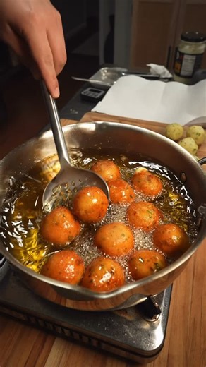 Jose Xiloj on Instagram: "Hot, crispy, and kind of naughty. These crispy cheesy potatoes will be the highlight at any Christmas table#potatoes My recipe - 3 large ahh golden potatoes 1C grated reggiano 1/4C chopped parsley 2tsp OCEAN (salt) 1/4tsp black pepper 2tsp granulated garlic 2Tbsp beef tallow 1/2C corn starch Tip- before adding cornstarch make sure the potatoes flavor is on point. White Cheddar cut into 1/2” cubes and stuffed inside the potato dough. Fry at 350f till golden. Keep the bal