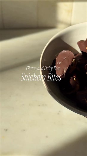 Mini Snickers Bites 🍫 Vegan, gluten-free, no-bake Comment “snickers” for the full recipe! ingredients — Vegan chocolate chips Dates, pitted and cut into pieces Peanut butter Peanuts Flaky sea salt Ice cube mold instructions — melt chocolate → pour a thin layer in molds → add a date piece → top with a bit of peanut butter peanuts → cover with chocolate → sprinkle sea salt → freeze until firm → enjoy! #minisnickers #vegantreats #nobakedessert #healthyindulgence #healthydesserts #chocolatesweets #