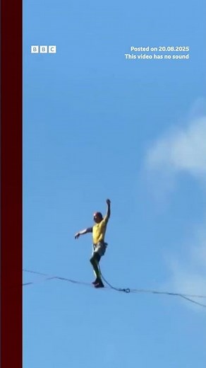 Competitors walk slackline 400m above a Chinese gorge. #BBCNews