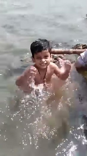 Child bathing in Narmada River