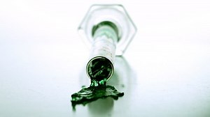 clip-6430487-graduated-cylinder-falling-spilling-green-liquid-slow