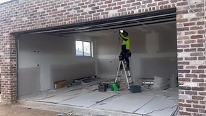 Custom garage door installed cladded with colorbond AMA nail strio in matte monument #garagedoor #architecture #newhome #sydneyconstruction #builder