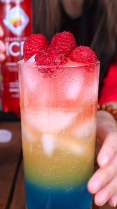 2.2K views · 34 reactions | Consider us obsessed.  Thank you, @cookingbomb, for this delicious recipe to keep the summertime alive! Rainbow Raspberry Drink ingredients 1 Sparkling Ice Orange Mango 1 Sparkling Ice Cherry Limeade Blue syrup Raspberries Follow Vivian’s easy steps to layer the colors of the rainbow! | Sparkling Ice | Facebook