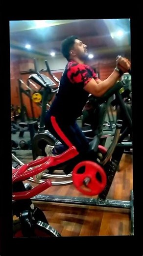 Gym Instructor Using Ab Glider Machine For Abdominal Exercise And Side Shaper