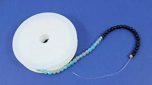 How to make a bracelet with elastic thread?