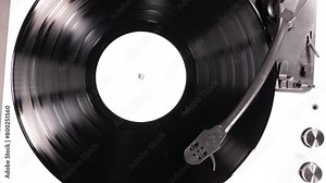 Vinyl retro record on DJ turntable record player. Black vinyl background with white screen in center.