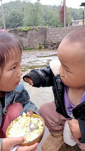 Lovely brother and sister eating vegetable rice for breakfast. | Succulent Therapy