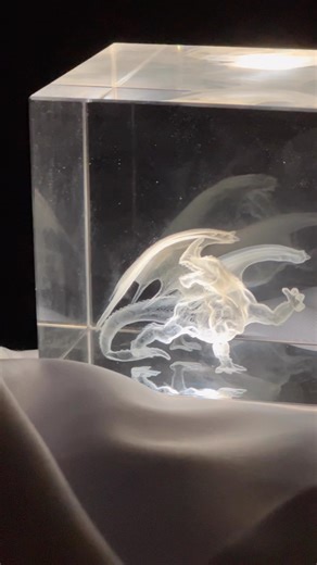 3D engraving in glass 🐉 Check out the blog on our site to learn all about this! 💥 #MadeWithFSL #LaserMachines #LaserEngraving #GlassCube #3DEngraving | Full Spectrum Laser
