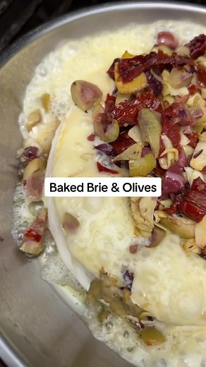 Let's just say this recipe is brie-lliant! Serves: 4-8 Prep time: 10 minutes Bake time: 20 minutes Special tools: small saucepan Ingredients: Baked Brie with Olives 1 wheel double cream brie 1 cup mixed olives 3 sun-dried tomatoes 3 artichoke hearts Grilled Garlic Bread 2-4 sourdough, sliced 1/2 stick butter 3 cloves garlic 2 tablespoons chives, chopped 1 big pinch kosher salt 1-2 red chillies, chopped 1/3 lemon 2 twists black pepper Method: For the Baked Brie with Olives: 1. Take the top of the