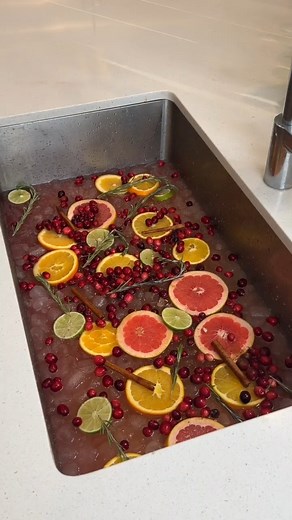 Try this easy holiday punch! Serving a holiday punch in a clean sink is the perfect way to serve parties. This original video was produced by My Life, Network Media and Allie Sparks. | Life According to Us