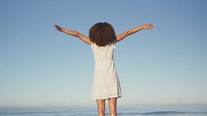 Rear view of African American woman enjoying at the beach | Free Stock Video Footage