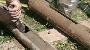 Geologist taking core samples out from drilling pipe for geological survey