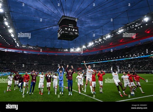 18 April 2026, Hesse, Frankfurt/M.: Soccer, Men: Bundesliga, Eintracht Frankfurt - RB Leipzig, Matchday 30, Deutsche Bank Park. The RB Leipzig players cheer with the fans after the match. Photo: Florian Wiegand/dpa - IMPORTANT NOTE: In accordance with the regulations of the DFL German Football League and the DFB German Football Association, it is prohibited to utilize or have utilized photographs taken in the stadium and/or of the match in the form of sequential images and/or video-like photo se