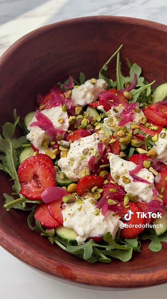 Strawberry & Burrata Salad 🍓☀️ AD The perfect Summer salad tbh. All thanks to @Sainsbury’s Taste The Difference Strawberries. Ingredients: 250g Taste the Difference Strawberries, sliced Drizzle of balsamic glaze 100g rocket ½ cucumber, sliced 1 ball of burrata cheese 80g pistachios, chopped Handful of pickled red onions (optional) Black pepper Method: Slice the strawberries and toss them in a bowl with a drizzle of balsamic glaze. Halve the cucumber and roughly crush the pistachios. On a bed of