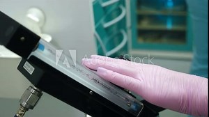 Doctor anesthesiologist setting nitrous oxide apparatus. Doctors using Inhalation Sedation. Dental clinic with modern procedures. 4 k video