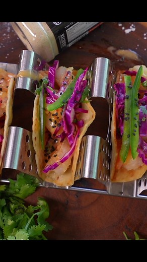 Blackstone Betty shows Chef Nathan Lippy how to make you a delicious, crispy sweet chili shrimp taco that was inspired by a local restaurant! Ingredients ½ lb small-medium shrimp, peeled ½ cup corn starch 1 tbsp Blackstone Honey Jalapeno Seasoning 4-6 street-size flour tortillas 1 jalapeno, deseeded and thinly sliced into strips Oil for frying Sauce: ½ cup Dukes Mayo ½ cup Sweet Thai Chili Sauce Slaw: 1 cup thinly sliced red cabbage ½ cup chopped cilantro 2 tbsp rice wine vinegar 2 tsp sesame oi