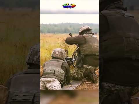 U.S. Soldiers and Ukrainian soldiers firing DShK machine gun