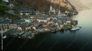 Aerial View of Austrian City. Hallstatt Drone Shot from Hallstatt Skywalk Welterbeblick Aussichtsplattform. Ancient City in the European Alps. Antique Buildings near the Lake. Tourism Concept