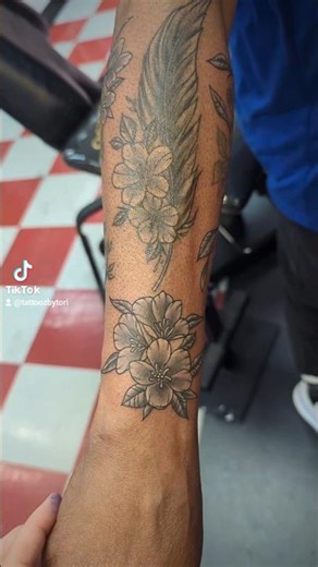 Some healed some fresh tattoos of black and grey