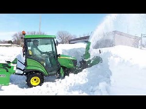 John Deere 1025R Taking Down Snowbanks