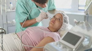 With precision and expertise, cosmetic doctor utilizes RF lifting attachment to deliver skin-tightening procedure, leaving client with visible and satisfying results.