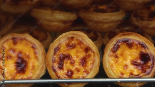 Pasteis and Pastel de nata, traditional Portuguese egg custard tart pasty cakes, dessert Pasteis de nata with different pastry in the cafe, bakery display window, Pastel de belem, Lisbon, Portugal