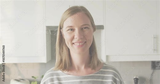 Adult woman in kitchen smiling as floating math equations appearing enhancing education engagement