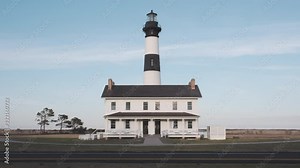 Historic Bodie Island Lighthouse in the Cape Hatteras National Seashore just after sunrise, Outer Banks, North Carolina, USA