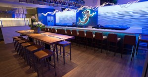 Alexandria’s New Oyster Bar Uses an Old Dry Cleaning Conveyor to Hold 120 Whiskeys