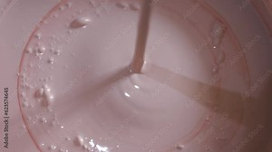 mixing paint. painting. repair. mixing paint with a construction mixer. water-based paint. mixing water-based paint in a bucket using a construction mixer with a whisk. close-up.