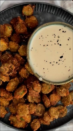 Crispy, golden, and absolutely addictive 🔥 This Southern fried okra hits different when you get that cornmeal coating just right. No slime, just crunch! The secret? Double coating in buttermilk egg, then seasoned cornmeal and flour. Let it rest for 15 minutes before hitting that 350° oil. Trust the process! Gone before dinner even hits the table 😅 Who else grew up fighting over the last piece? Want the recipe? Comment RECIPE below ⤵️ and I’ll send it over! #friedokra #southernfood #southerncoo