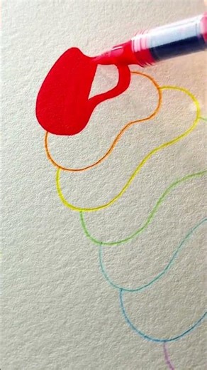Hand drawing colorful rainbow pattern on white paper