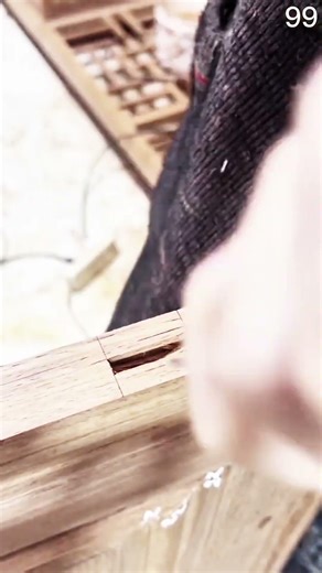 Chisel carves mortise clean, pencil lines guide precise joinery into solid wood grain