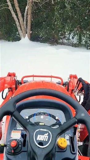 Kioti CS2220 pushing snow