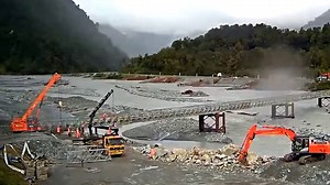 Bailey bridges are being installed in some places where existing bridges have been damaged or washed away by the recent floods. A Bailey bridge is a prefabricated single-lane bridge that can be installed relatively quickly—anywhere from a few weeks to a few months. We're continuing our work with the National Emergency Management Agency and local authorities to assess potential locations, and whether those sites can accommodate a Bailey bridge. Bailey bridges aren’t an instant fix. There’s planni