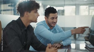 Business partners are discussing. Use computer. Speak in a modern office, discussing, explaining, financial, formal, handsome Shot on RED Epic Camera. Shot on RED Epic Camera.