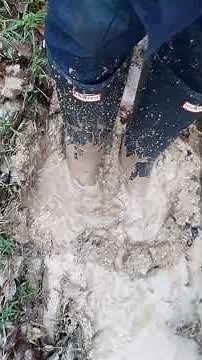 Walking in the forest in the mud with rubber boots - stuck gummistiefel