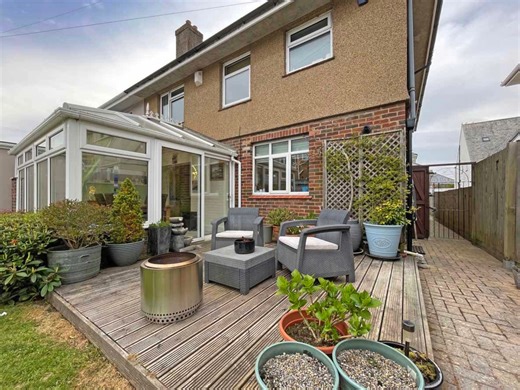 Reduced In Price - Crownhill £465,000 This beautifully presented, extended home is located on the sought after ‘Great Berry Estate’ and is within proximity to St Boniface School, Crownhill Village with its array of amenities and Widey Woods. Internally, the property has been well maintained and is a credit to the current owners. In brief, the ground floor accommodation comprises spacious hallway, living room with dual aspect and feature fireplace, a spacious kitchen/dining room open plan to the 