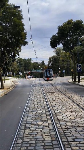 City Tram Moving Through Cobblestone Streets #traffic #city