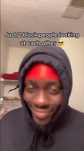 Just two black people looking at each other