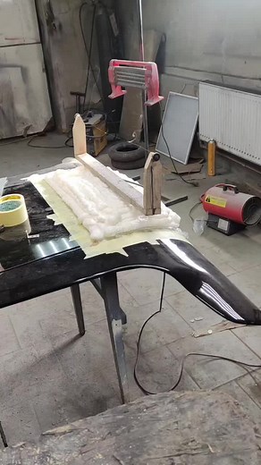Applying Foam for Car Detailing in a Workshop