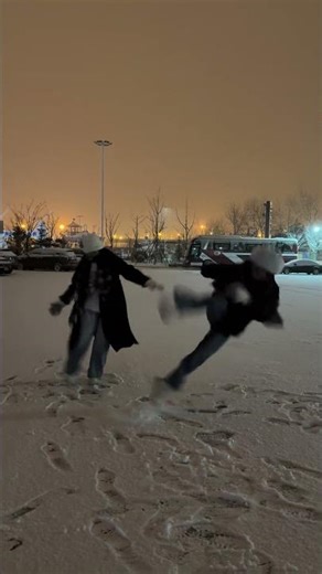 Woman slips while trying to kick snowball in Jiangxi, China