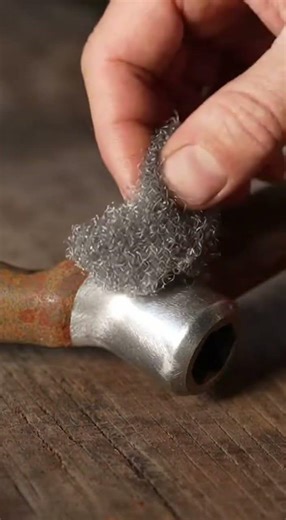 rusty old socket wrench being restored